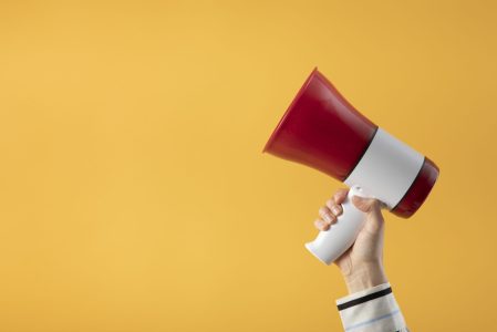 hand-holding-megaphone-side-view